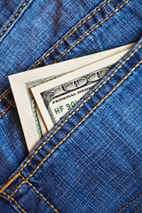 Jeans pocket with dollars banknotes