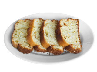 Plum cake on white dish.