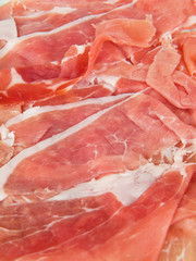 Closeup of raw ham sliced.