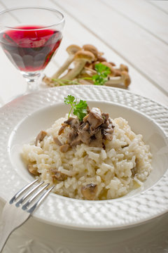 mushroom rice over dish with red wine -riso ai funghi