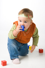 Small girl play with blocks