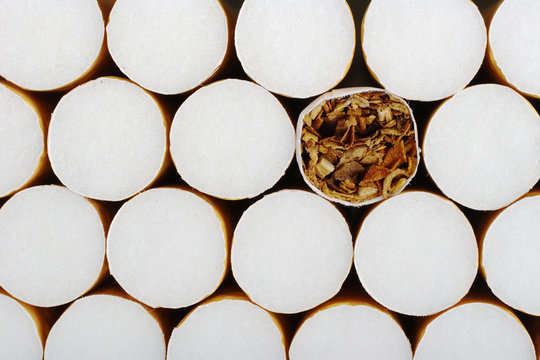 Cigarette without filter in between ones with filter