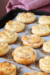 Puff pastry rolls with ham, salami and cheese