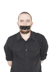 Young man scotch-tape on his mouth
