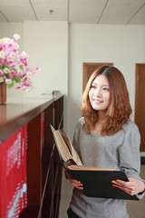 young asian girl in library