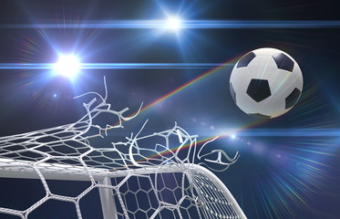 shot on goal, soccer ball tears the net - 22969914