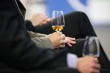 holding wine glasses