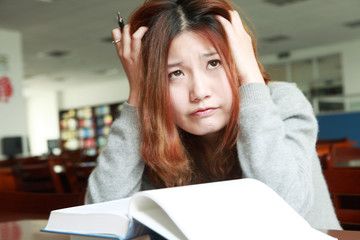 asian girl studying in library