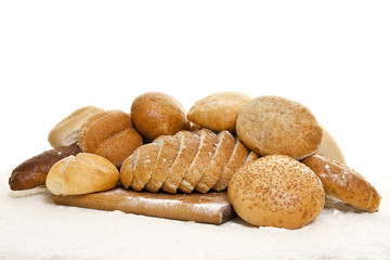 bread on a wooden board sprinkled with flour