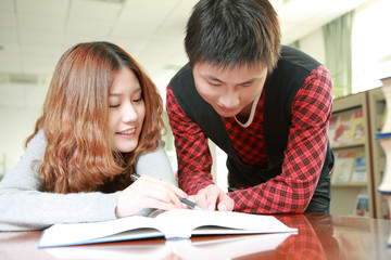 Fototapeta na wymiar asian boy and girl studying in library