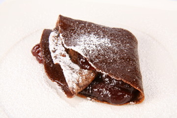 Chocolate panke with strawberry jam covered with caster sugar