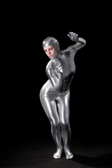 Obraz na płótnie Canvas Beautiful girl in futuristic suit