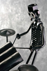 A drummer figure made from screws, bolts and other metal parts