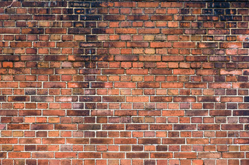 Old and dirty red brick wall