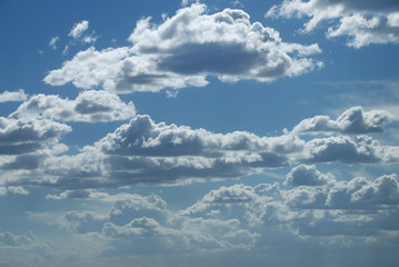Bright sunny clouds against blue sky
