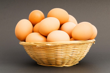Basket of eggs on the colourful background