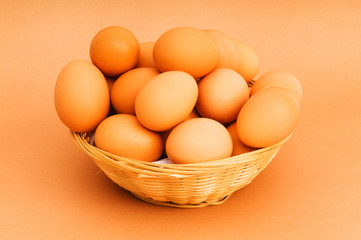 Basket of eggs on the colourful background