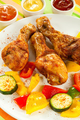 Roasted chicken drumsticks and vegetables