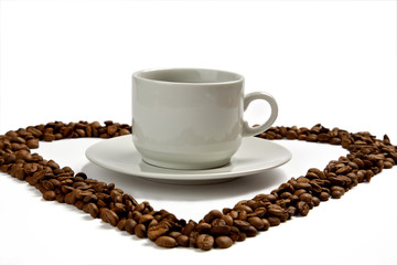 cup of coffee and spilled coffee beans