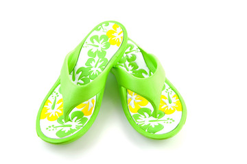 green summer slippers over white background