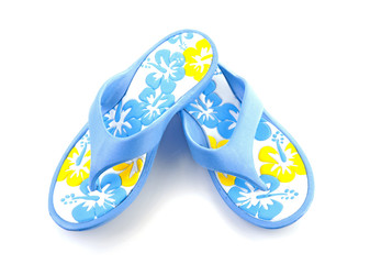 blue summer slippers over white background