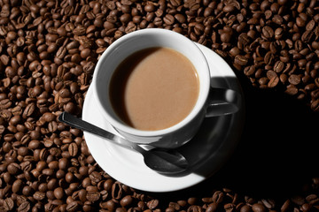 Cup with coffee, costing on coffee grain