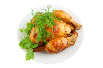 Grilled chicken with greens on plate isolated