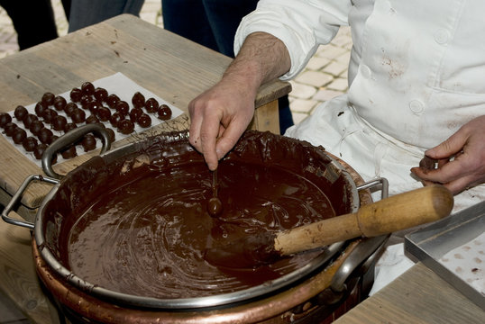 Close-up on dark chocolate delicacies maker