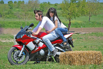 Obraz na płótnie Canvas couple on a motorbike