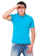 Fototapeta premium handsome man in blue t-shirt is scrutinizing