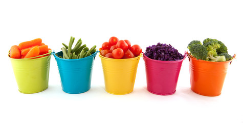 Fresh vegetables in colorful buckets