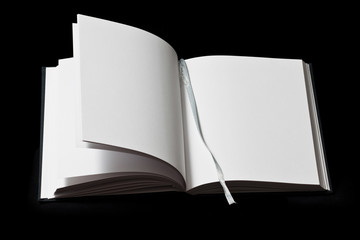 A blank book open, on black background