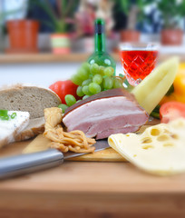 Meal concept with bread, tomatoes, cheese, wine, bacon