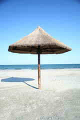Wood sunshade shot at Corbu beach, Romania