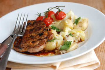 Pork loin steak with new potatoes