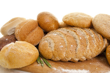 bread on a wooden board sprinkled with flour