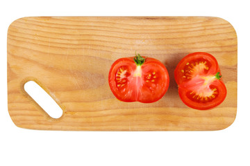 cut tomato on kitchen board .
