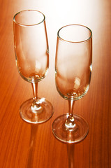 Wine glasses against wooden background