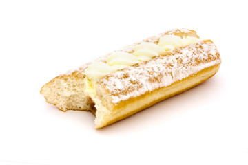 cream cake with a bite taken over white
