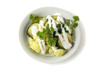 Stewed vegetables with sour cream in a bowl