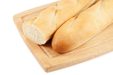 Fresh baguette on the board isolated on white