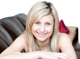 Portrait of an attractive woman lying on the sofa