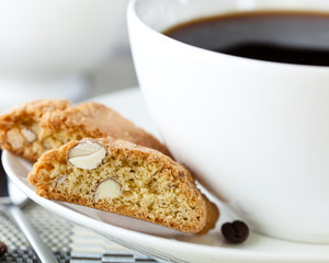 Close-up of cantuccini and a cup of black coffee