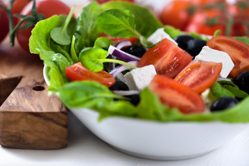 Salad with goat cheese,tomatoes and tatsoi