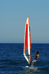 Naklejka premium an image of a man windsurfing on summer time