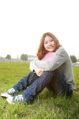 Fototapeta premium asina reading book on grass