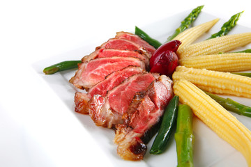 roast meat served with corns