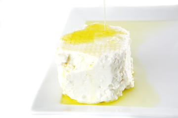 Obraz na płótnie Canvas whole soft cheese in oil