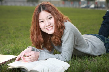 asina reading book on grass