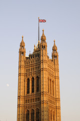 Fototapeta na wymiar tower with United Kingdom flag on Houses of Parliament